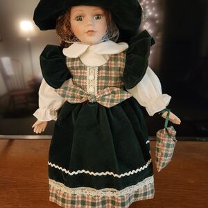 Porcelain Doll in Dark Green Velvet Dress with Plaid Accents